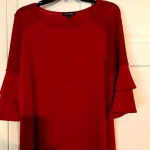 Cranberry top with mid length bell sleeves.